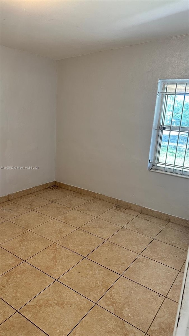 view of tiled spare room