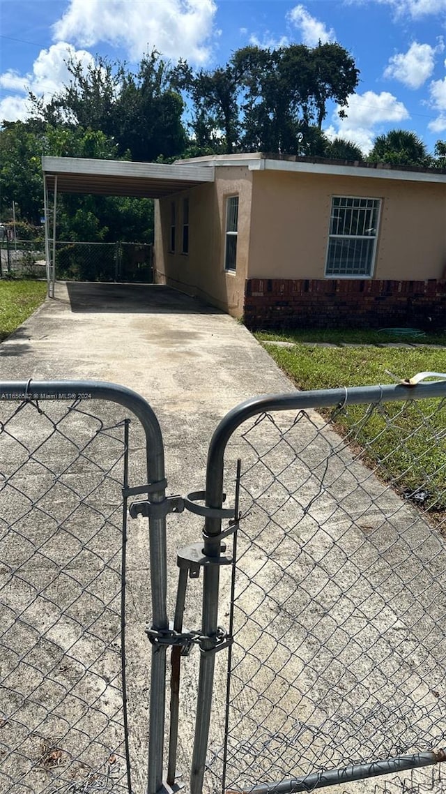 exterior space featuring a carport