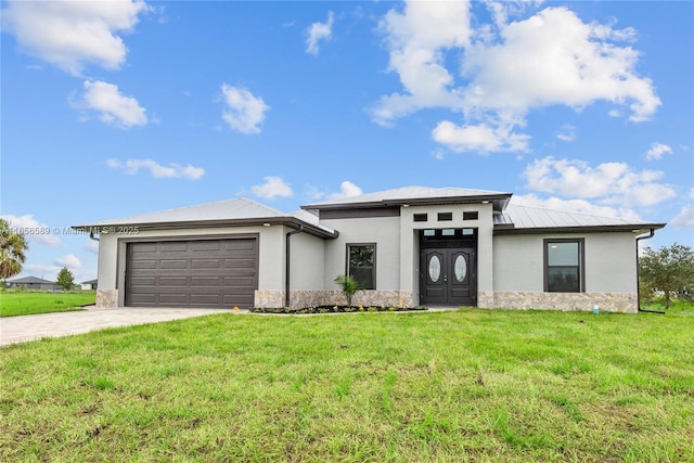 prairie-style house with a front lawn and a garage