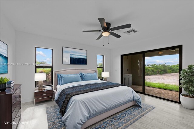 bedroom with access to outside, visible vents, and ceiling fan