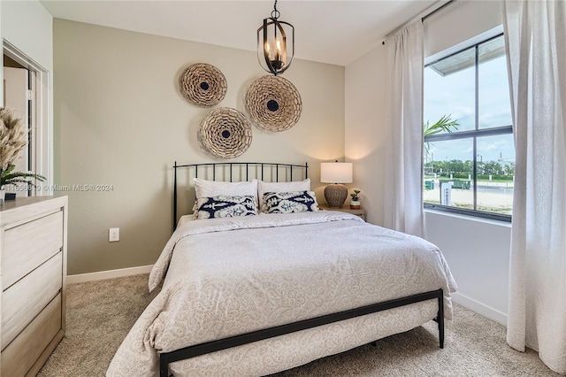 bedroom featuring light carpet