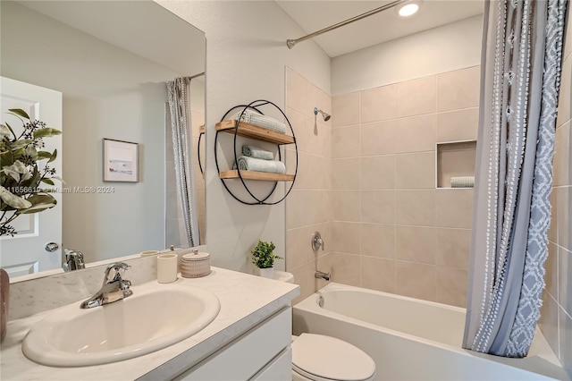 full bathroom with vanity, toilet, and shower / bath combo with shower curtain