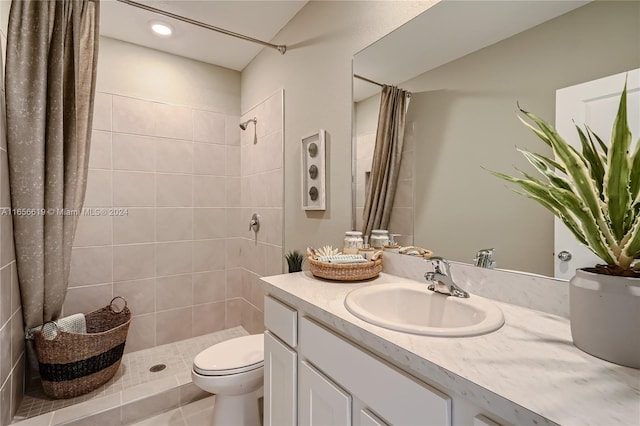 bathroom with vanity, toilet, a shower with shower curtain, and tile patterned floors