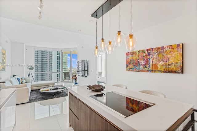 interior space with decorative light fixtures and light tile patterned flooring