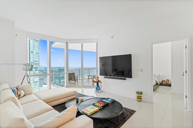 tiled living room featuring floor to ceiling windows and plenty of natural light