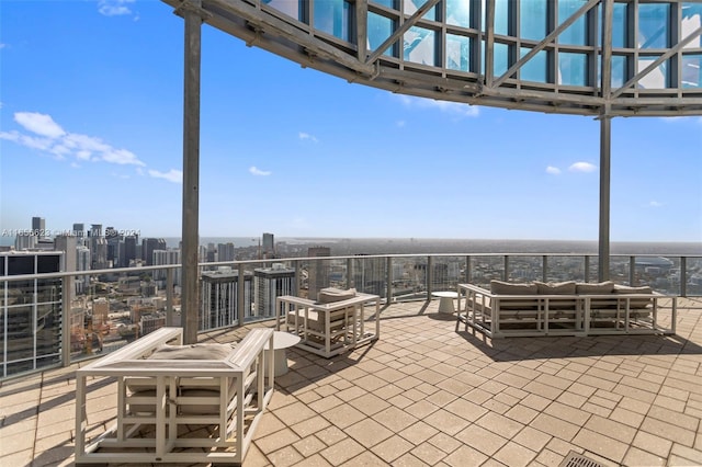 view of patio featuring outdoor lounge area and a balcony