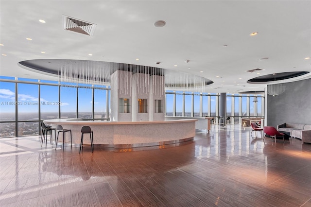 kitchen featuring expansive windows and a center island