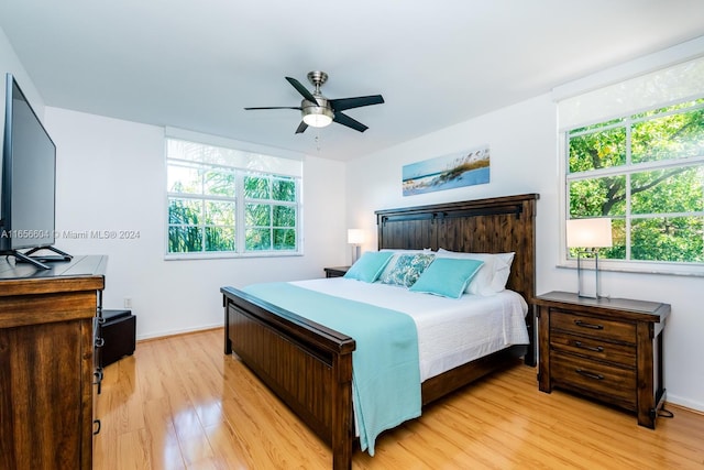 bedroom featuring light hardwood / wood-style flooring and ceiling fan