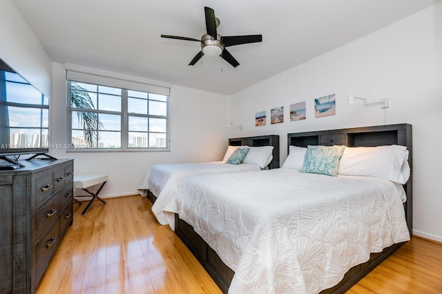 bedroom featuring light hardwood / wood-style flooring and ceiling fan