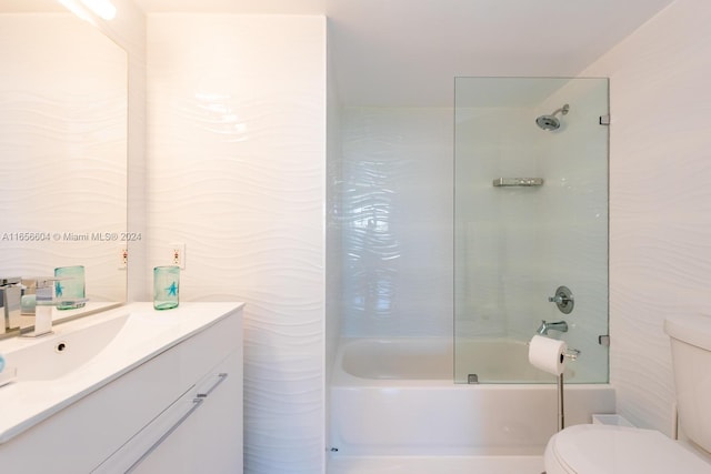 full bathroom with toilet, tiled shower / bath combo, and vanity