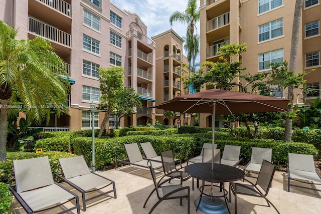 view of patio featuring a balcony