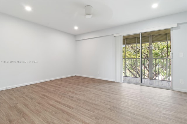 spare room with light hardwood / wood-style flooring