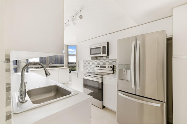 kitchen featuring a sink, white cabinetry, and stainless steel appliances