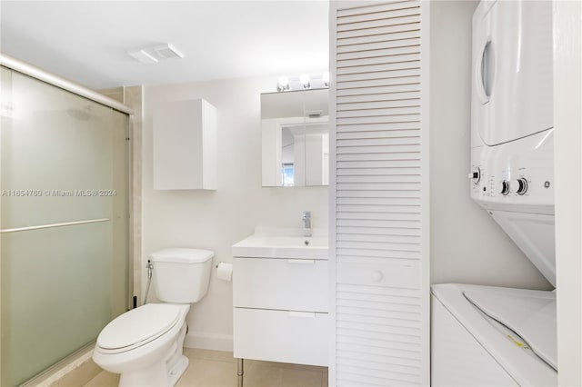 bathroom featuring a shower stall, stacked washer and dryer, tile patterned flooring, visible vents, and toilet