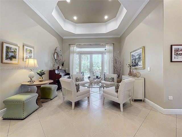 tiled living room with french doors, crown molding, and a tray ceiling