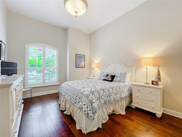 bedroom featuring dark hardwood / wood-style flooring