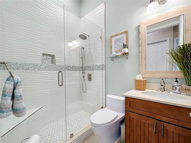 bathroom featuring vanity, toilet, and walk in shower