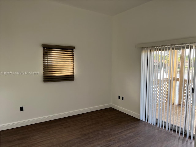 empty room featuring dark hardwood / wood-style flooring