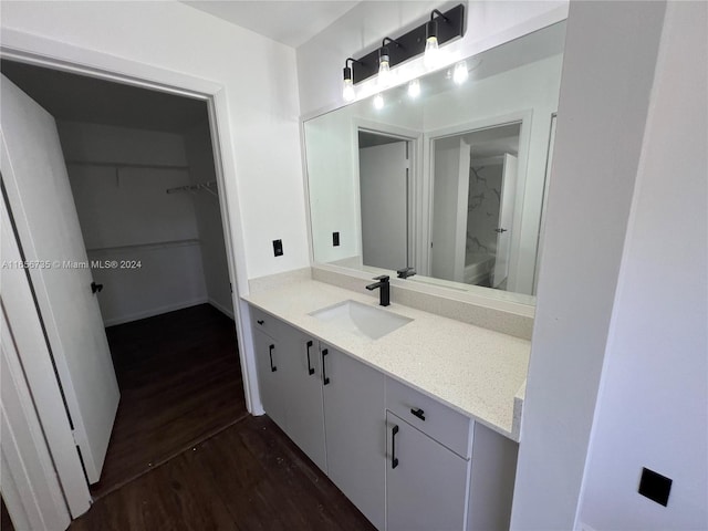 bathroom featuring vanity and hardwood / wood-style flooring