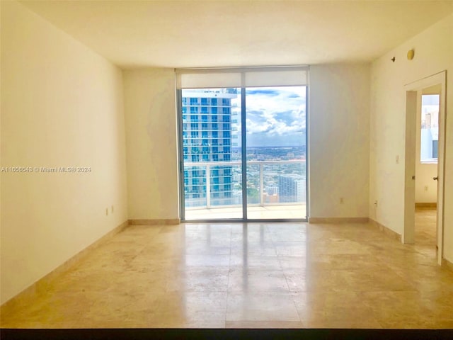 spare room featuring floor to ceiling windows