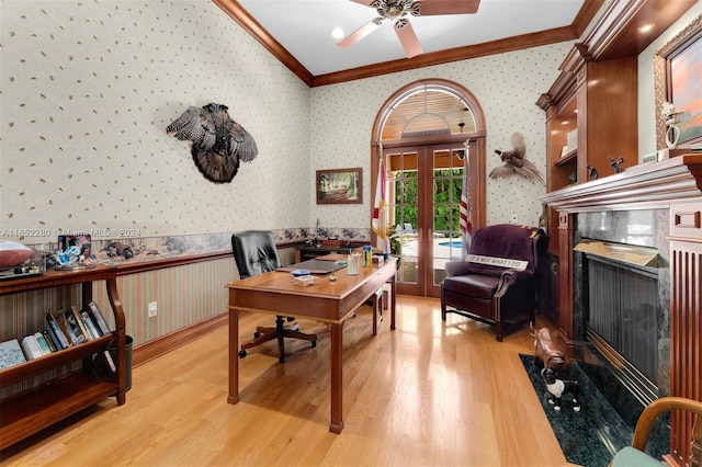 home office with ornamental molding, ceiling fan, light hardwood / wood-style flooring, and french doors