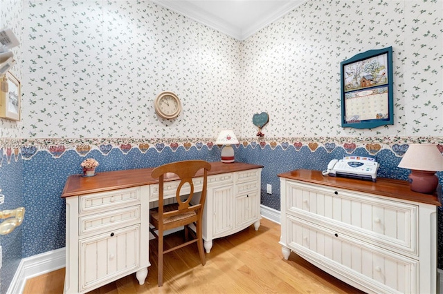 home office featuring ornamental molding and light hardwood / wood-style flooring