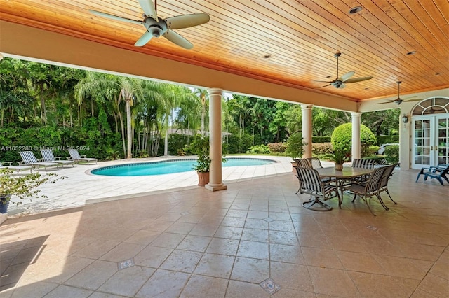 view of pool featuring ceiling fan, french doors, and a patio area