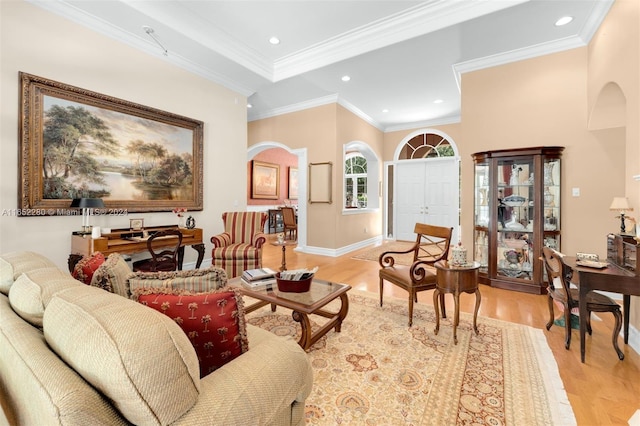 living room featuring light wood-type flooring and crown molding