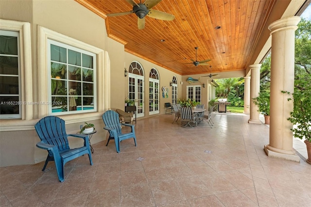 view of patio / terrace featuring ceiling fan and french doors