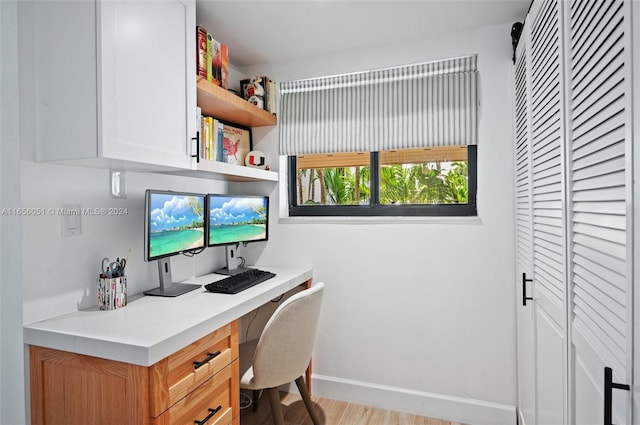 2600 Cardena St Unit 11, Coral Gables, FL 33134 - office area with built in study area, baseboards, and wood finished floors