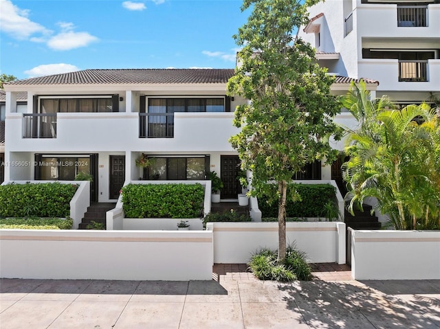 view of front of property with a balcony