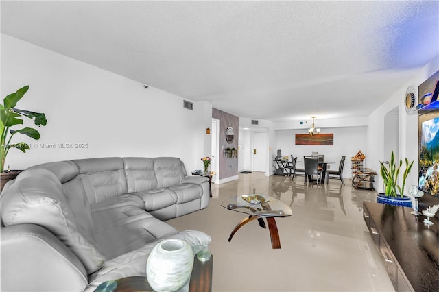 living room with light tile patterned floors and a textured ceiling