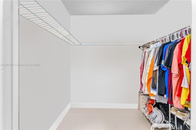 900 NE 195th St Unit 317, Miami, FL 33179 - walk in closet featuring tile patterned flooring