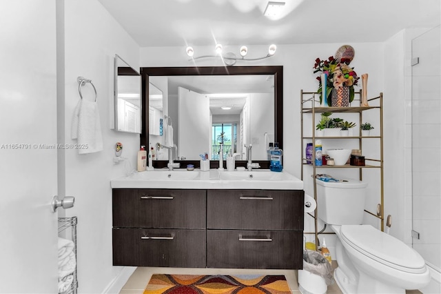 bathroom featuring vanity, toilet, and a shower with door