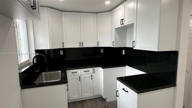 kitchen featuring plenty of natural light and white cabinetry