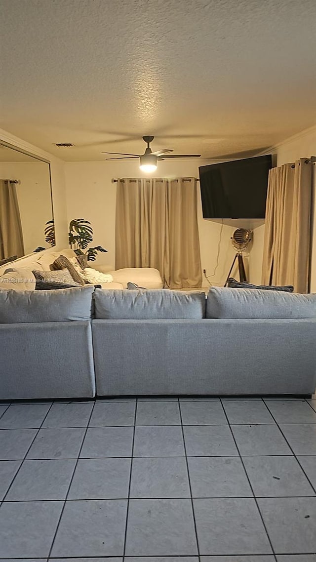 2239 Atlanta St, Hollywood, FL 33020 - living room with light tile patterned floors, visible vents, and a textured ceiling