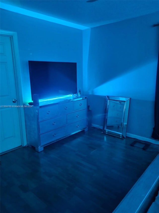 unfurnished living room featuring dark hardwood / wood-style flooring