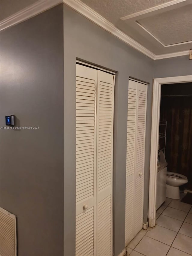 details featuring crown molding and tile patterned floors