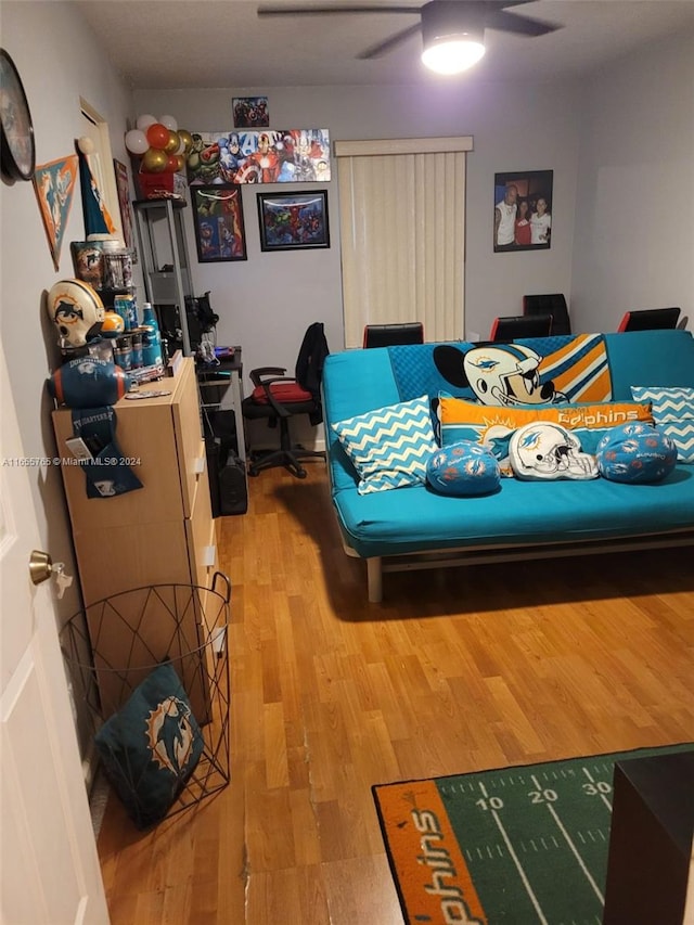 bedroom with ceiling fan and hardwood / wood-style flooring