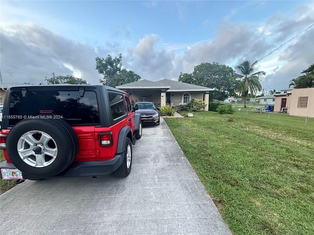 2239 Atlanta St, Hollywood, FL 33020 - view of front facade with driveway and a front yard