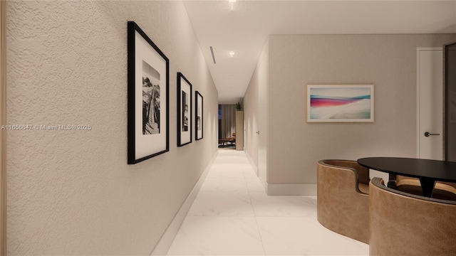 300 Biscayne Blvd Way Unit 3503, Miami, FL 33131 - hallway with light marble finish flooring, baseboards, and a textured wall