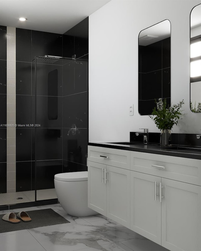 bathroom featuring toilet, vanity, and tiled shower