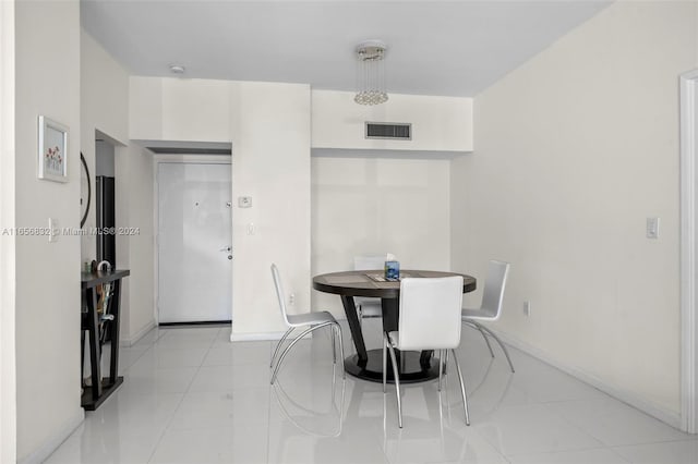 dining area with light tile patterned flooring