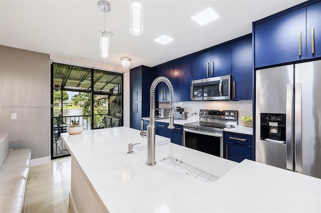 kitchen with blue cabinets, an island with sink, tasteful backsplash, decorative light fixtures, and stainless steel appliances