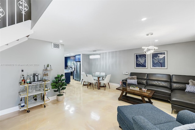 living room featuring a chandelier