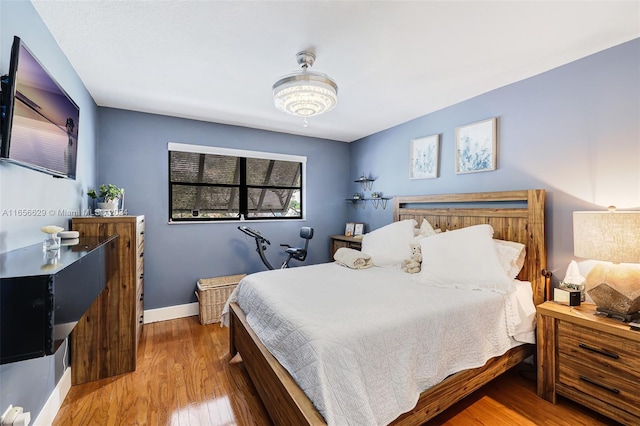 bedroom featuring wood-type flooring