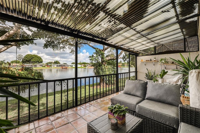 sunroom / solarium with a water view