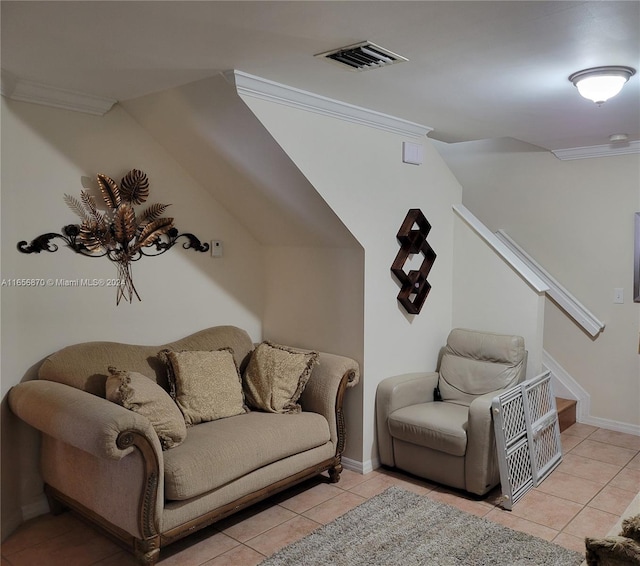 living room featuring ornamental molding and light tile patterned floors