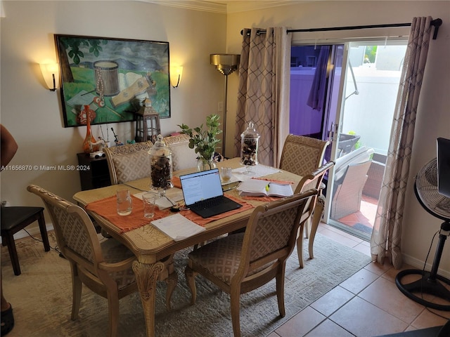 tiled dining room with ornamental molding