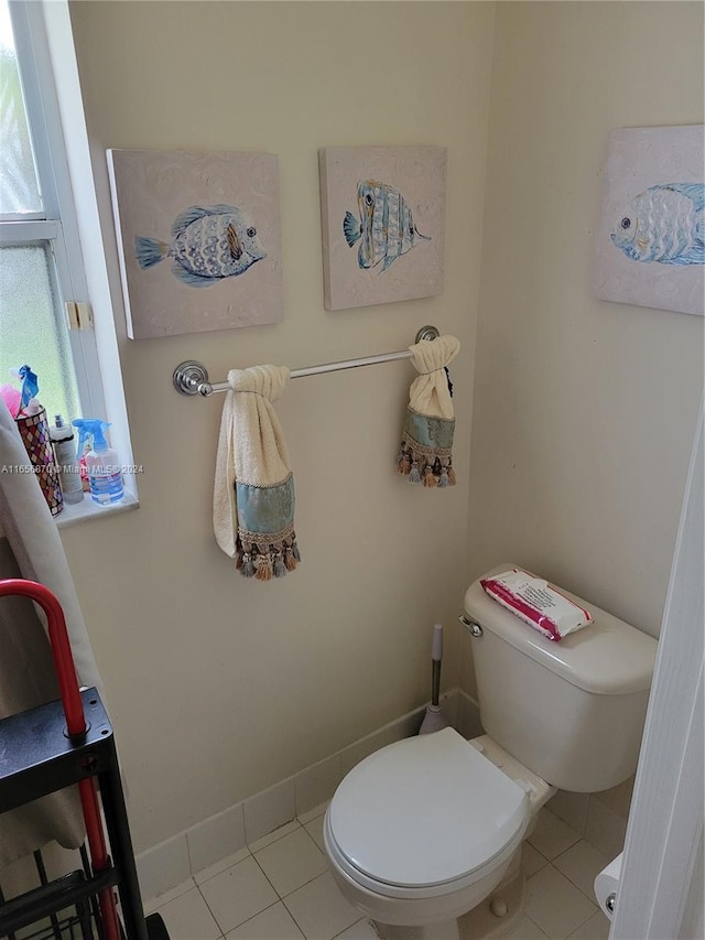 bathroom with tile patterned floors and toilet